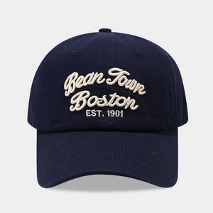 Close-up of Bean Town Boston 1901 3D embroidery on navy blue cotton baseball cap