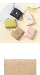 Detail of five colored PU leather wallets with leaf pattern and metal leaf buckle