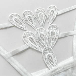 Seductive white lace thong with intricate floral embroidery and hollow out detail