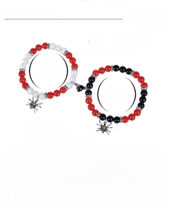 Detailed view of elastic Halloween spider charm bracelets with 8mm beads and magnetic heart