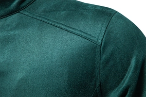 Detail of double stitching on the shoulder of this dark green suede jacket for men