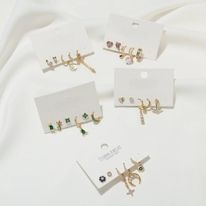 Detailed set of gold plated S925 silver earrings with moon and star zircon motifs