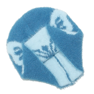 Macro del morbido tessuto a maglia in finta pelliccia con motivo jacquard a farfalla
