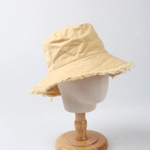 Retro yellow canvas bucket hat with frayed edges for women, fashion sun protection hat