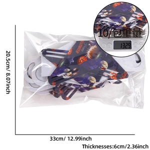 Detail of 10-pack Halloween non-woven felt bags on scale showing weight and dimensions