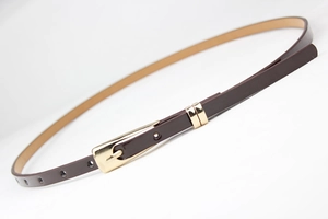 Detailed view of slim dark brown leather belt with elegant polished gold square buckle