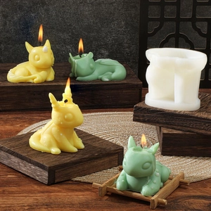 Cartoon animal silicone mold for DIY dragon candles shown in an elegant Zen setting