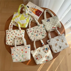 Multiple patterned quilted cotton handbags featuring cute animal and floral prints