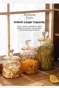 Detailed macro view of amber glass storage jars with heart lids and ribbed textures