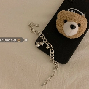 Detail shot of silver bear charm bracelet with lobster clasp and adjustable link chain