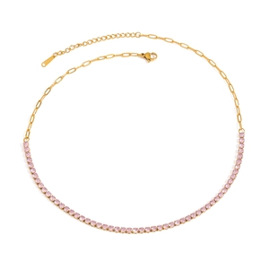 Detail of pink crystal tennis necklace with golden paperclip chain and lobster clasp
