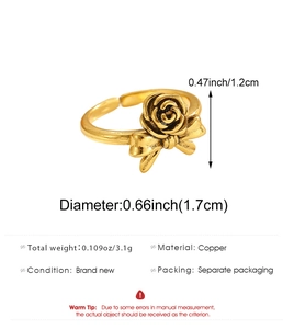 Detail view of vintage copper ring with rose and bow design including size measurements
