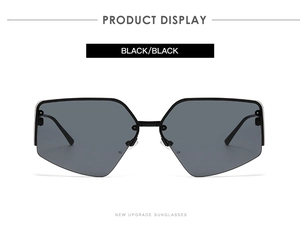 Front view of black oversized semi-rimless geometric polygon sunglasses on white background