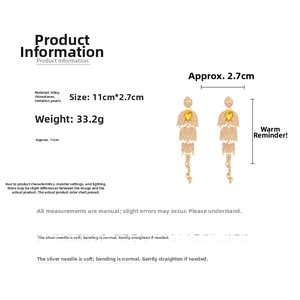 Detailed size chart showing long gold tassel earrings with teardrop pearls and crystals