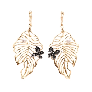 Golden monstera leaf earrings with black enamel butterfly and elegant white pearls