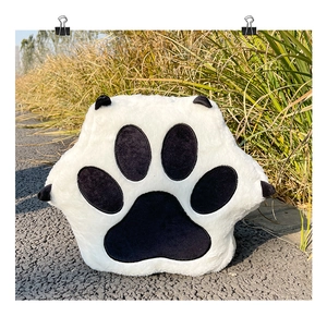 Detailed view of plush cat paw backpack featuring soft faux fur and black paw pads