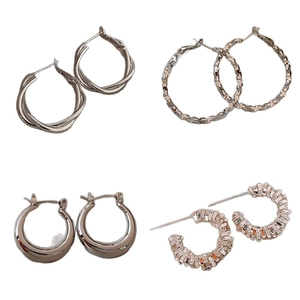 Minimalist silver C-shape geometric hoop earrings set with diverse metal textures