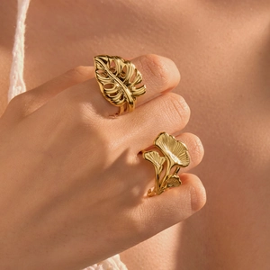Elegant gold stainless steel leaf rings featuring monstera and ginkgo leaf designs