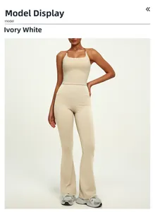 Detailed full-length view of the ivory white high-waist flared yoga pants and tank top set