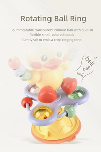 Close-up of rotating ball toy with 360-degree spinning yellow duck and colorful rattle beads