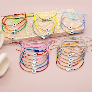 Bracciali bohémien in perline Miyuki con ciondolo malocchio e cordino regolabile