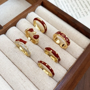 Set of 6 vintage 14k gold plated rings with red enamel and floral patterns