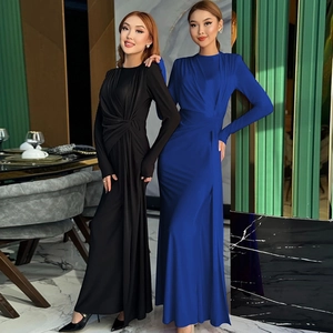 Close-up of elegant slim-fit long-sleeved evening dresses in premium satin silk fabric