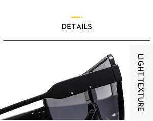Detail of black semi-rimless sunglasses frame with silver rivets and light texture