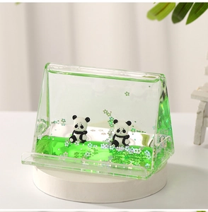 Triangle panda liquid stand with floating green glitter and sand effect detail