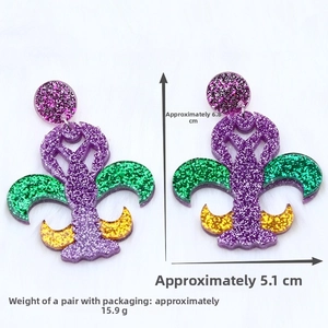 Macro view of Mardi Gras lobster acrylic earrings with green and purple sequins
