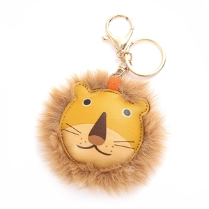 Cartoon lion leather keychain with brown plush trim and gold metal ring on white background