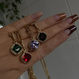 Gold chain necklaces with square multi-color gemstone pendants in red, green, purple, and black