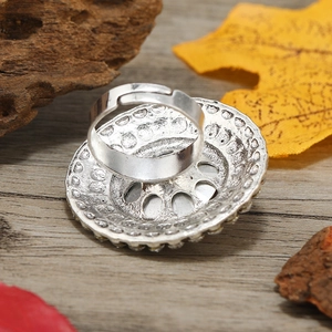Detail view of the adjustable silver bohemian ring showing the back side and carving