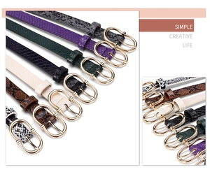 Detail showing various snake skin belts in purple, green, and brown with gold buckles