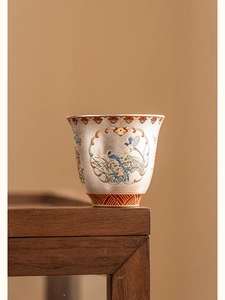 Detail of silver-plated tea cup featuring filigree enamel and magpie plum blossoms