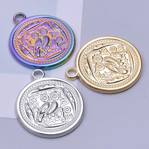 Owl coin pendant in 18k gold, silver, and iridescent finishes made of stainless steel