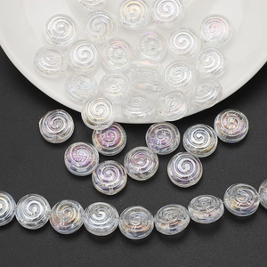 Macro shot of iridescent spiral crystal glass beads for DIY jewelry making and crafts