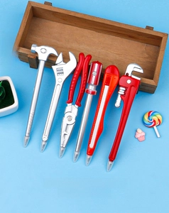 Detail of creative tool-shaped ballpoint pens with 0.5mm tip showing pliers and hammer
