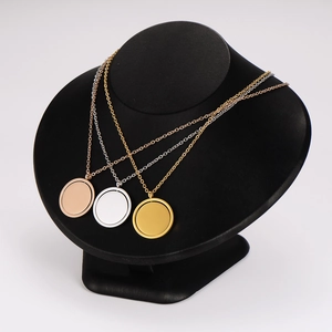 Three round stainless steel pendant necklaces in rose gold, silver, and gold finishes
