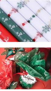 Close-up of Christmas tissue paper with snowflake and elk patterns for gift wrapping