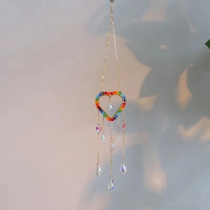 Detail of heart suncatcher with colorful beads and crystal droplets for home decor
