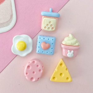 Cute resin food charms featuring bubble tea and heart cookies in pastel macaron colors