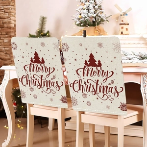 Detail of Christmas chair covers with Merry Christmas text and festive tree patterns