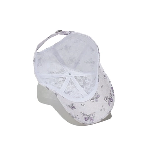 Detail view of breathable white lace mesh baseball cap with purple butterfly embroidery