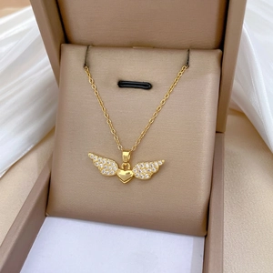 Elegant gold angel wing heart necklace with sparkling crystals in a gift box