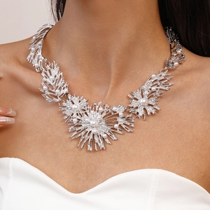 Close-up of metallic pearl flower necklace showing intricate silver texture and detail
