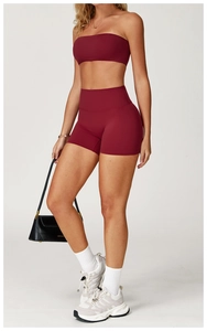 Detail view of burgundy brushed yoga set featuring bandeau top and high-waist biker shorts
