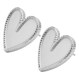Macro shot of silver heart studs with twisted edge and white mother of pearl inlay