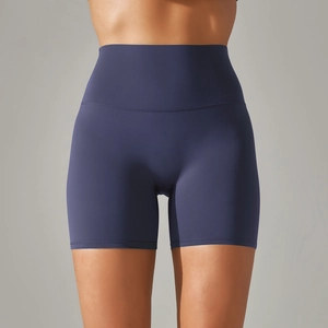 Detailed close-up of dark purple high-waisted yoga shorts with seamless flatlock stitching