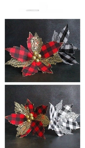 Macro detail of checkered Christmas poinsettia flowers with gold glitter mesh leaves